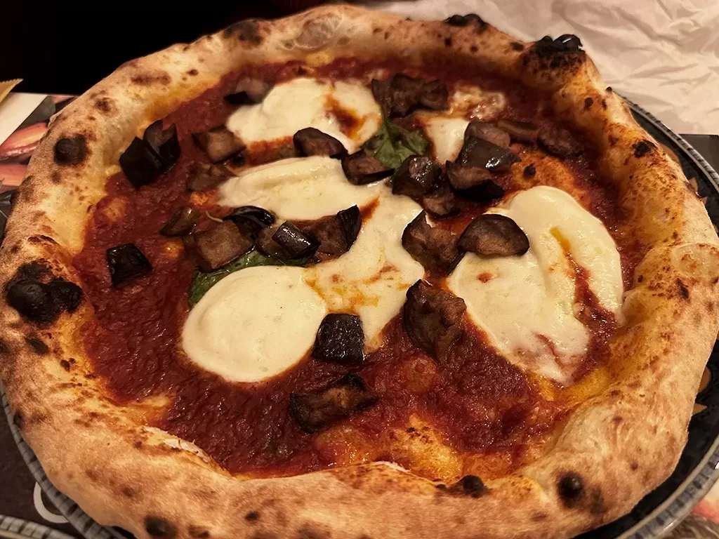 pizza with fried aubergine chunks and mozzarella