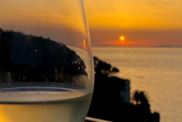 wine glass with sunset behind