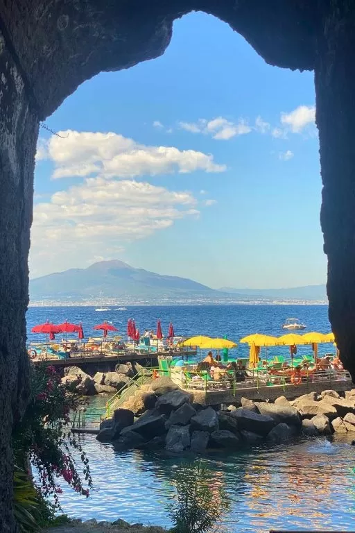 sorrento bathing platform view with mount vesuvius in the background