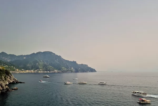 view of amalfi coast and boats from atrani