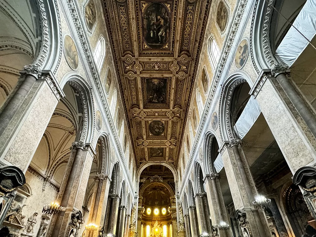 long view of ceiling of central nave in naples cathedral