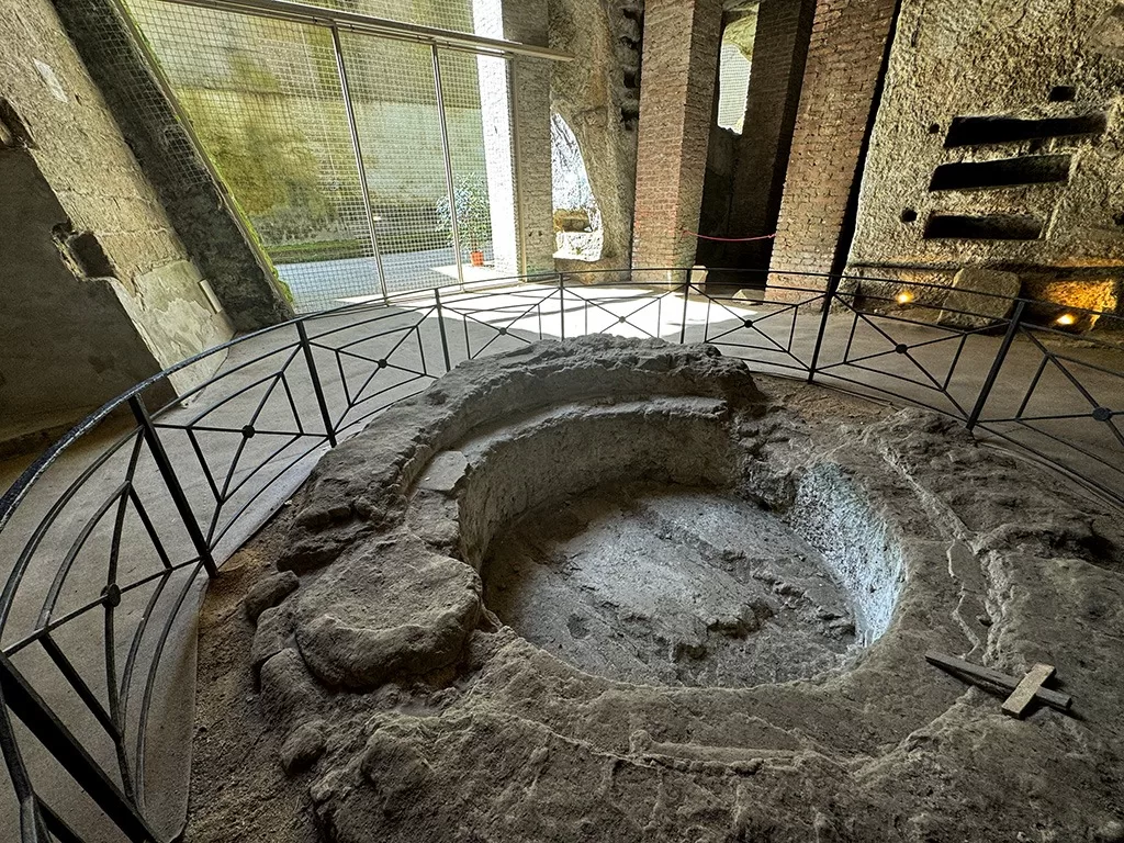 ancient baptismal font ruins in san gennaro catacombs