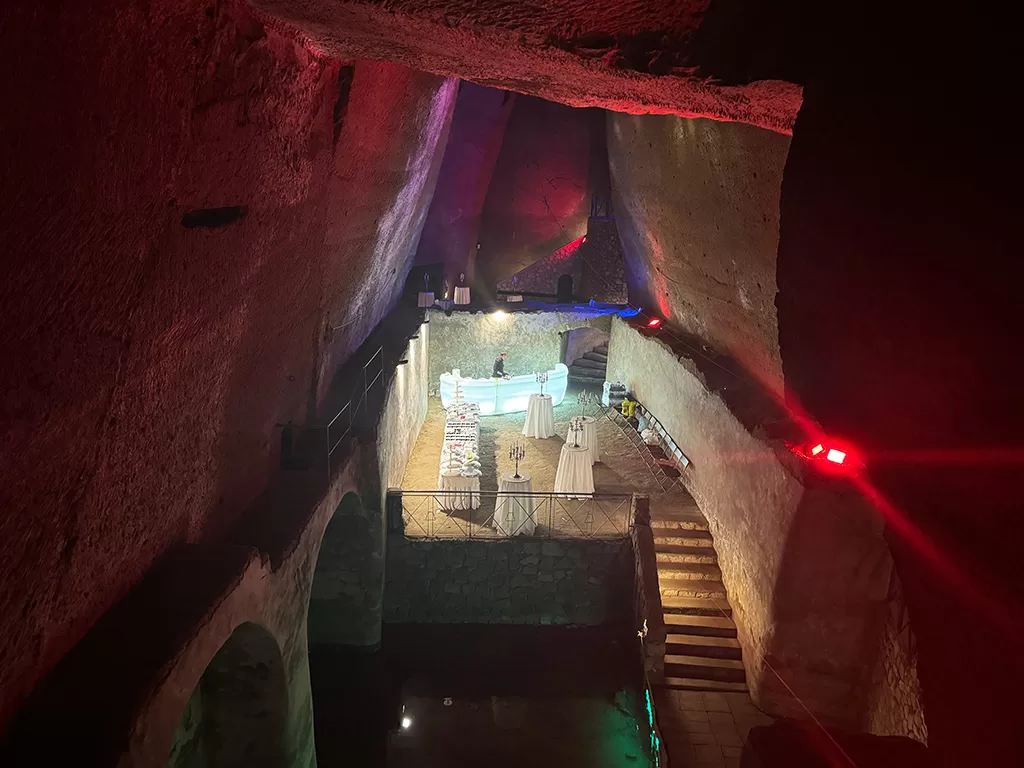 bourbon tunnel event space set up with white tables