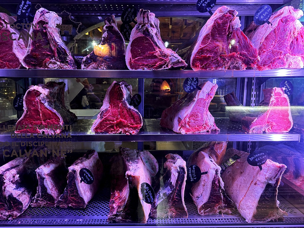 shelves of raw steaks ready to be cooked