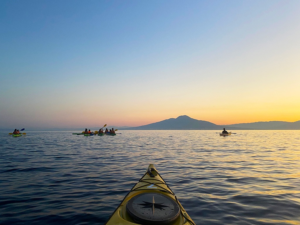 sorrento kayak at sunrise with view of vesuvius in background