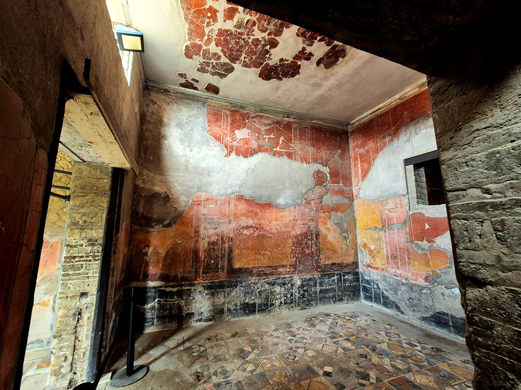 Herculaneum casa dei cervi interior room with frescoes