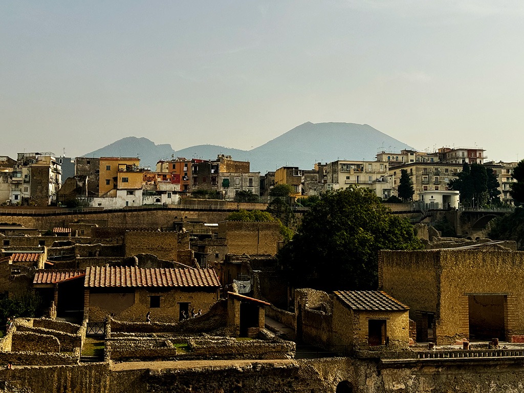 view of Vesuvius across modern rooftops of Ercolano