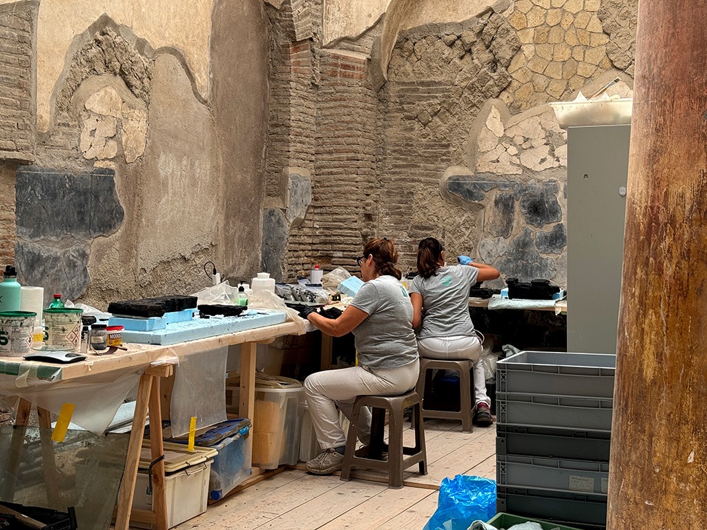 people working on restoration in Herculaneum