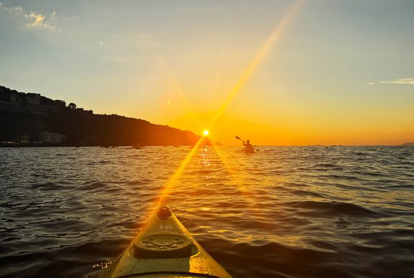 kayaking in sorrento sunset on the sea from kayak perspective