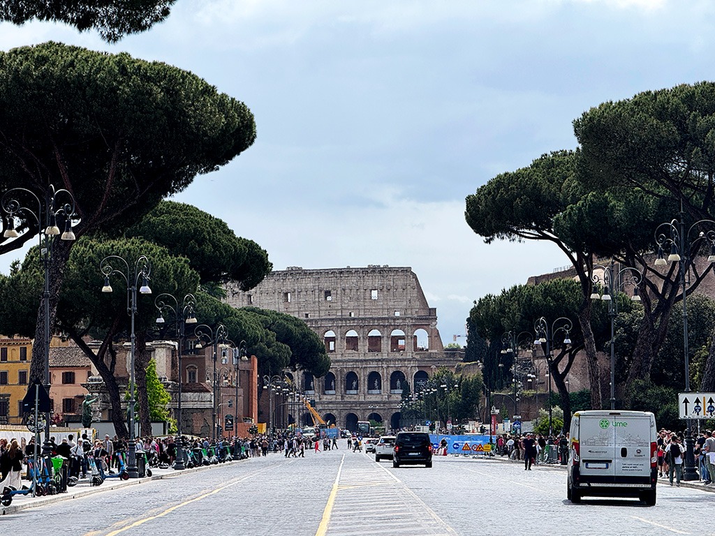view of colosseum from via dei fori imperiali