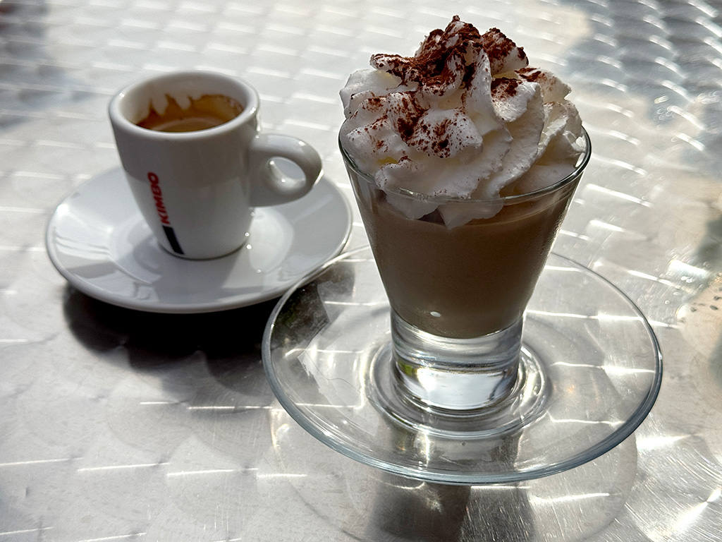 table with espresso and crema di caffe drinks on it