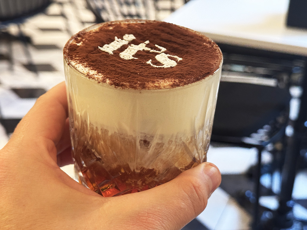coffee cocktail with its logo on top in icing sugar